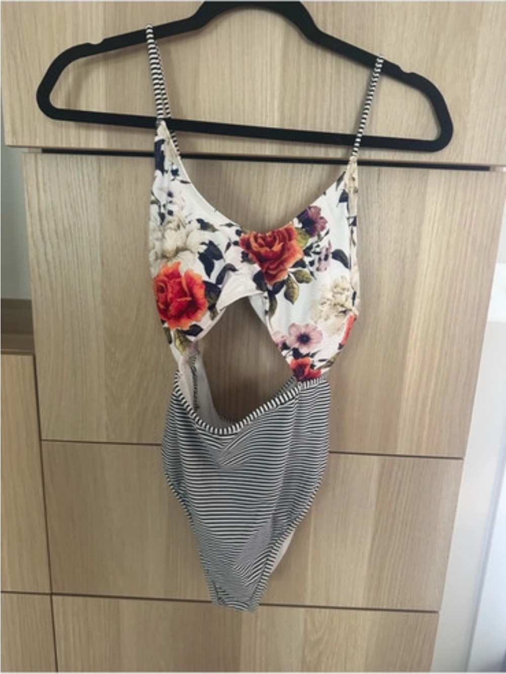 Floral and striped one piece suit. Size Large.